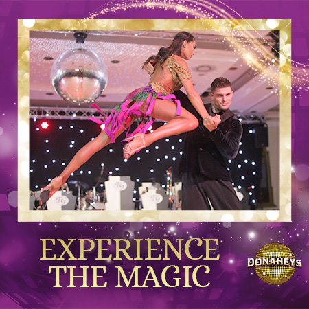 Dancer lifts a partner on stage under a disco ball; purple promotional frame reads “Experience the Magic.”