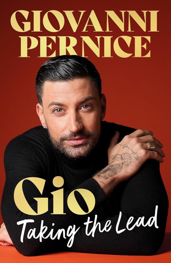 Book cover featuring Gio Pernice against an orange background with bold gold text 'GIOVANNI PERNICE' at the top and 'Gio Taking the Lead' in script at the bottom; close-up portrait of a man with dark hair and a tattooed hand.