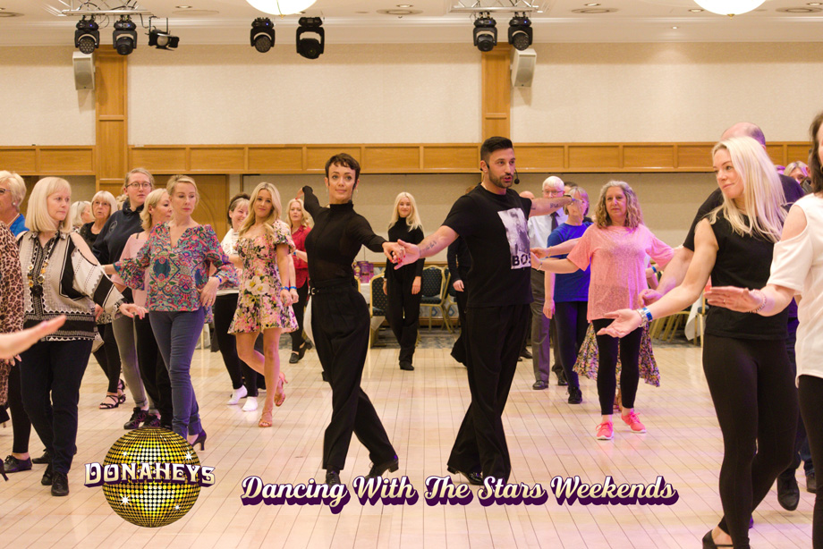 Giovanni Pernice and Lauren Oakley teaching a dance lesson at Donaheys